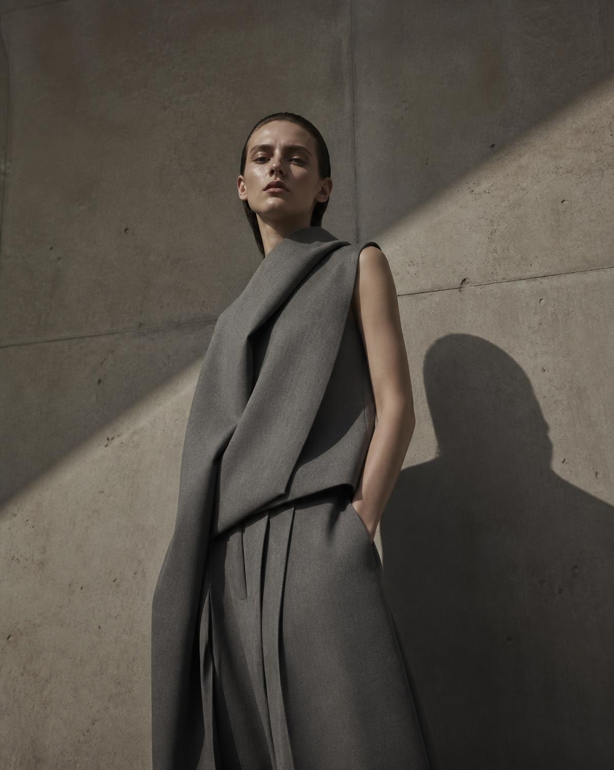 Fashion editorial visual against a concrete wall